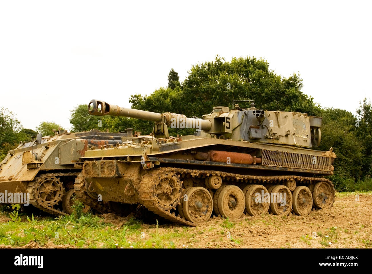 a-pair-of-ex-british-army-tanks-covered-in-mud-ADJJ6X.jpg
