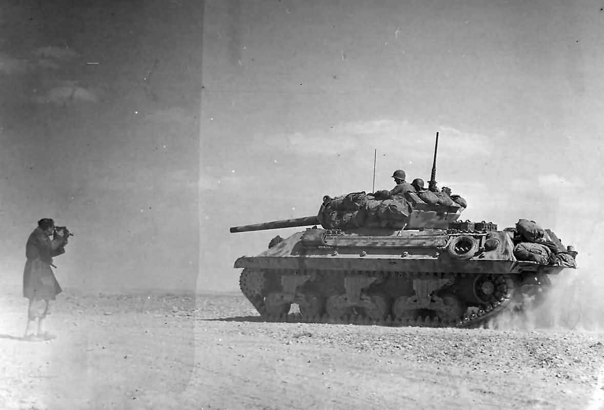 M10_Tank_Destroyer_Heads_To_Battle_Lines_At_Bir_Marbott_Pass_East_Of_El_Guettar_In_Tunisia_1943.jpg