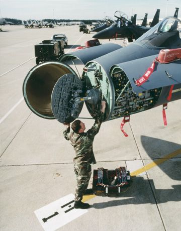 APG-63-all-weather-multimode-radar-being-serviced-in-the-nose-cone-of-an-F-15.jpg