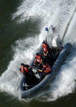 US_Navy_040518-N-9742R-001_United_States_Coast_Guardsmen_in_a_Rigid_Hull_Inflatable_Boat_(RHIB...jpg