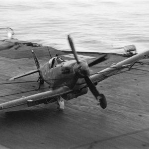 A_Supermarine_Seafire_hits_the_barrier_on_HMS_INDEFATIGABLE_after_returning_from_a_strike_on_the_Japanese_oil_refinery_at_Pangkalan_Brandan2C_Sumatra2