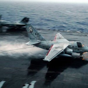 US_Navy_041014-N-6213R-022_An_S-3B_Viking_creates_a_rooster_tail_of_water_as_it_lands_on_the_wet_flight_deck_aboard_the_Nimitz-class_aircraf.jpg