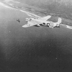 B-25J_Mitchell_77th_BS_Being_Attacked_by_Japanese_Fighter.jpg