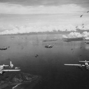 PBJ_Mitchell_Bombers_in_Heavy_AA_Fire_Rabaul_1944.jpg