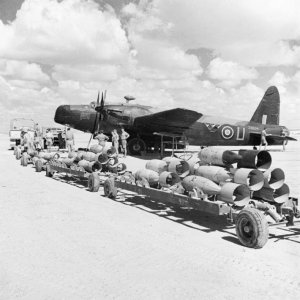 Vickers_Wellington_Mk_II_of_No__104_Squadron_RAF2C_about_to_be_loaded_with_500-lb_bombs_for_a_sortie_over_the_Western_Desert2C_1942__ME28RAF296297.jpg