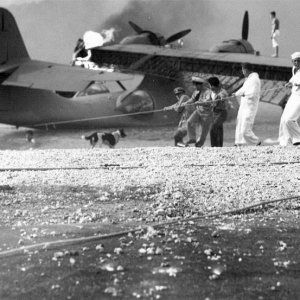 sailors-at-naval-air-station-kaneohe-hawaii-attempt-to-salvage-a-burning-pby-catalina-in-the-aftermath-of-the-japanese-attack-on-pearl-harbor-1.jpg