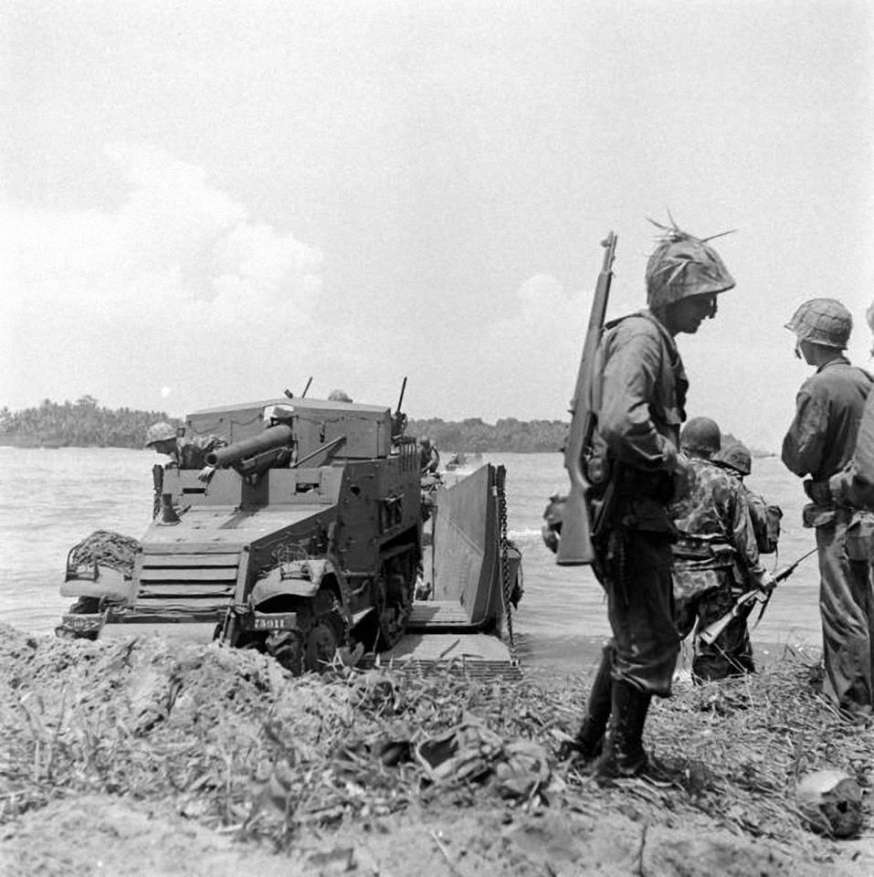 An_M3_75mm_GMC_coming_ashore_on_Bougainville2C_November_1943n.jpg