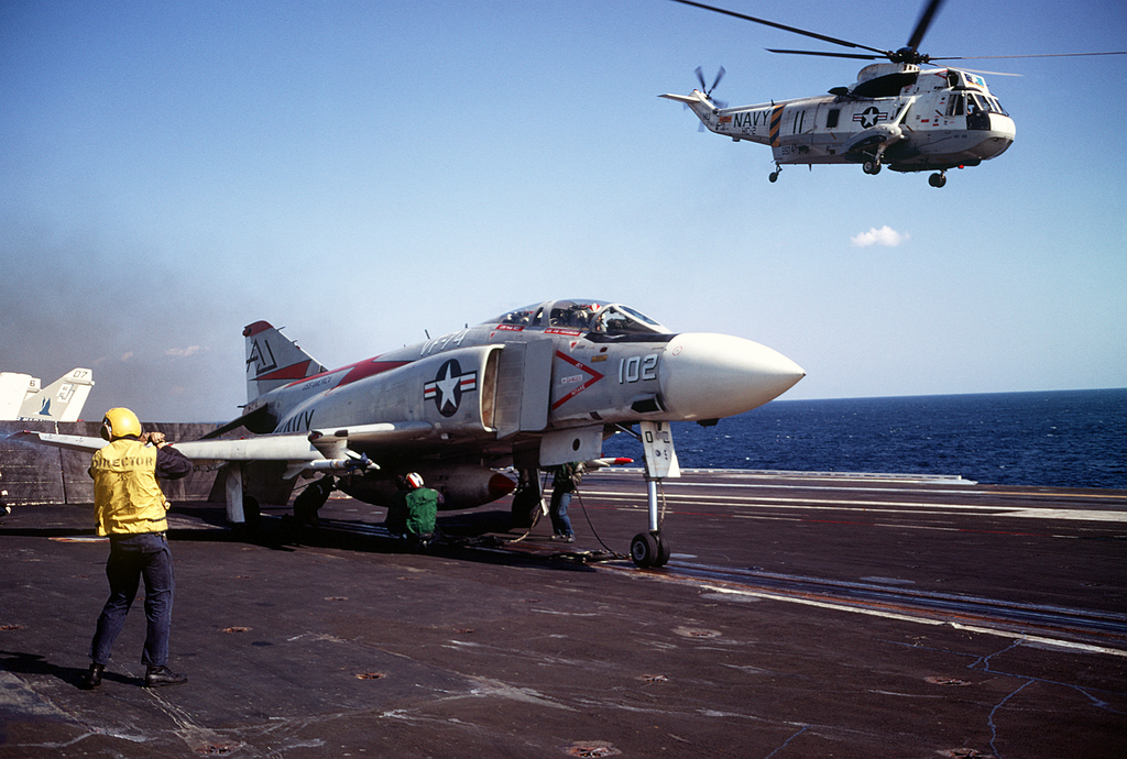 F-4J_and_SH-3G_on_USS_America_28CVA-6629_1972-73.JPEG