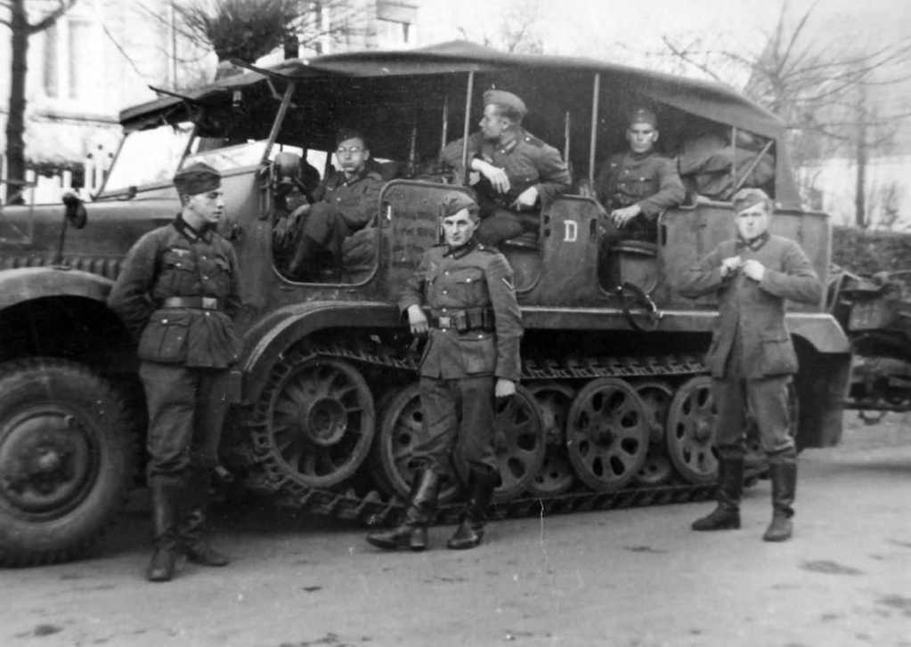 Wehrmacht_soldiers_next_to_a_SdKfz_6_halftrack.jpg